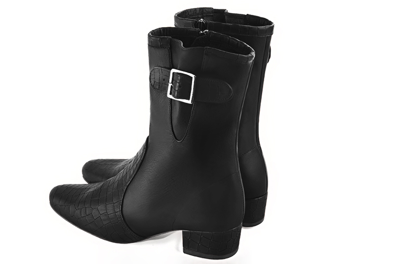 Satin black women's ankle boots with buckles on the sides. Round toe. Low block heels. Rear view - Florence KOOIJMAN